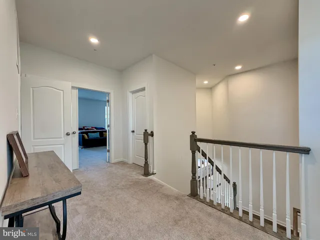 a bathroom with a granite countertop sink a toilet and a mirror