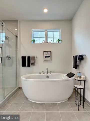 a bathroom with a toilet sink vanity and mirror