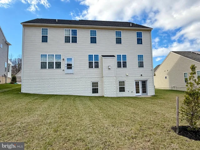 a view of a livingroom with furniture and hardwood floor