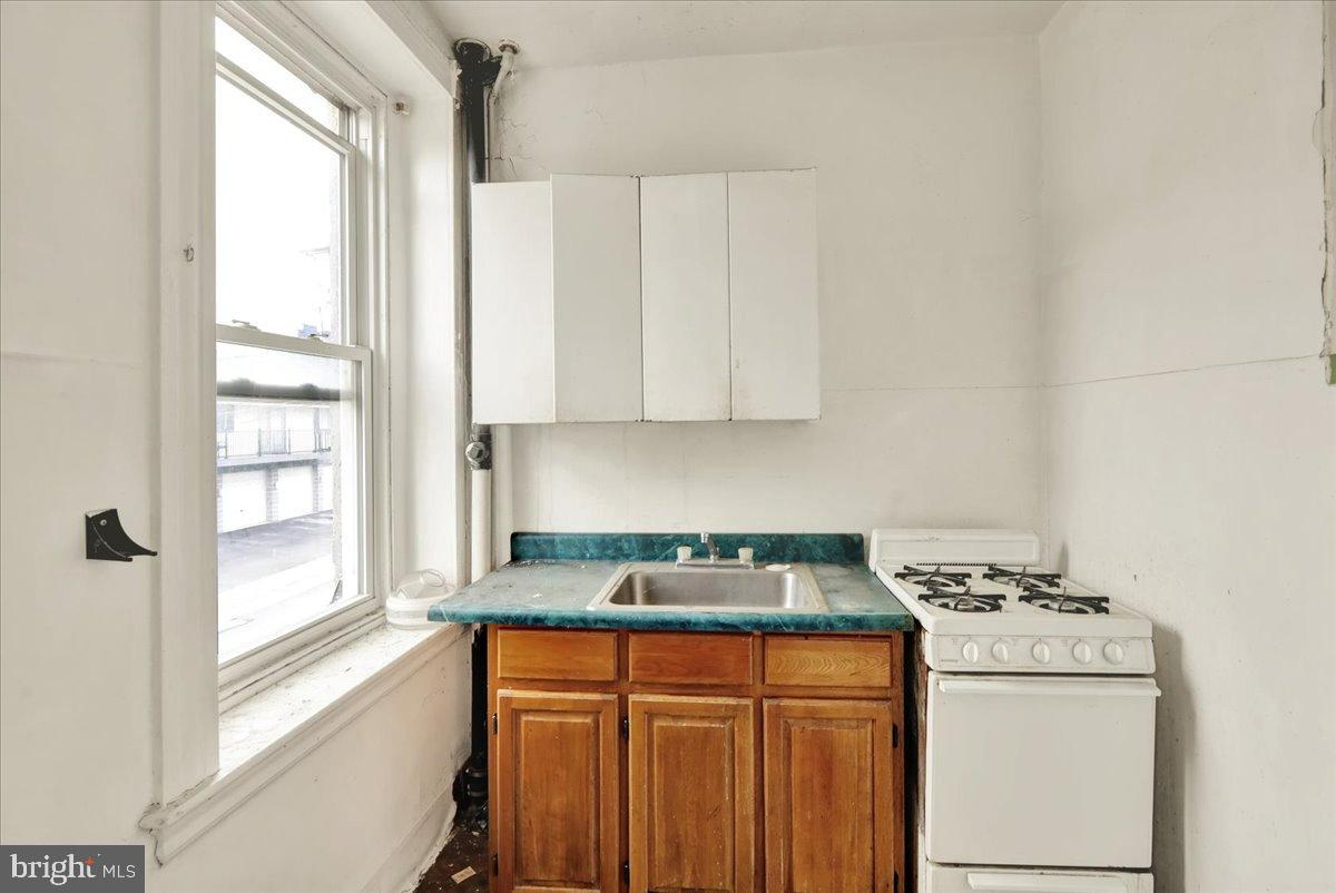 200 West Lancaster Avenue Reading, PA 19607 - Photo 38 of 50 a kitchen with stainless steel appliances granite countertop white cabinets and a stove top oven