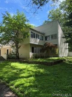 1117 Cedar Ridge Road Oyster Bay, NY 11771 - Photo 36 of 41 a front view of house with yard and green space