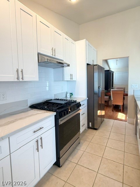 804 Rancho Coast Way Henderson, NV 89002 - Photo 17 of 20 Gleaming stone countertops and classic shaker cabinetry anchor this well-appointed cooking space.