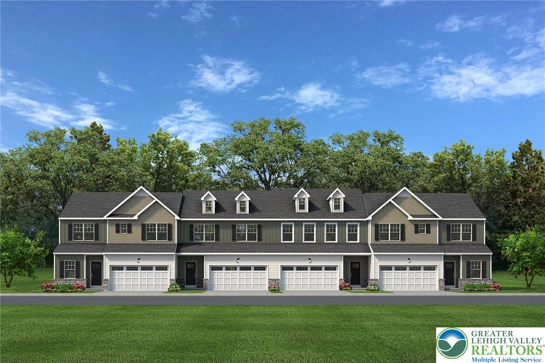 a view of house with garden and tall trees