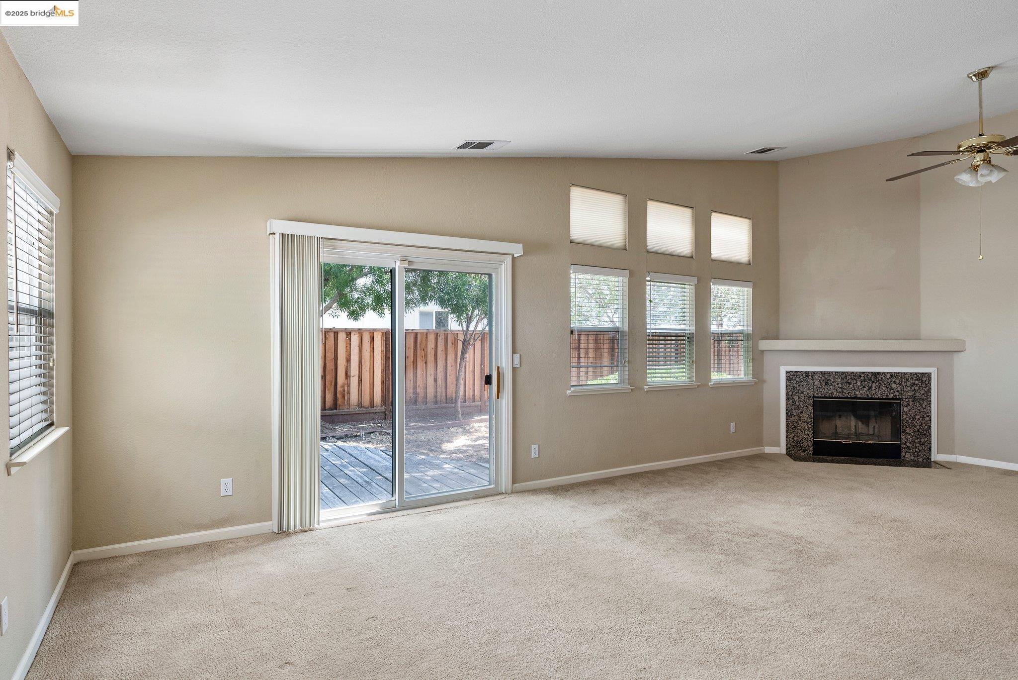 5200 Mohican Way Antioch, CA 94531 - Photo 17 of 50 an empty room with fireplace and windows