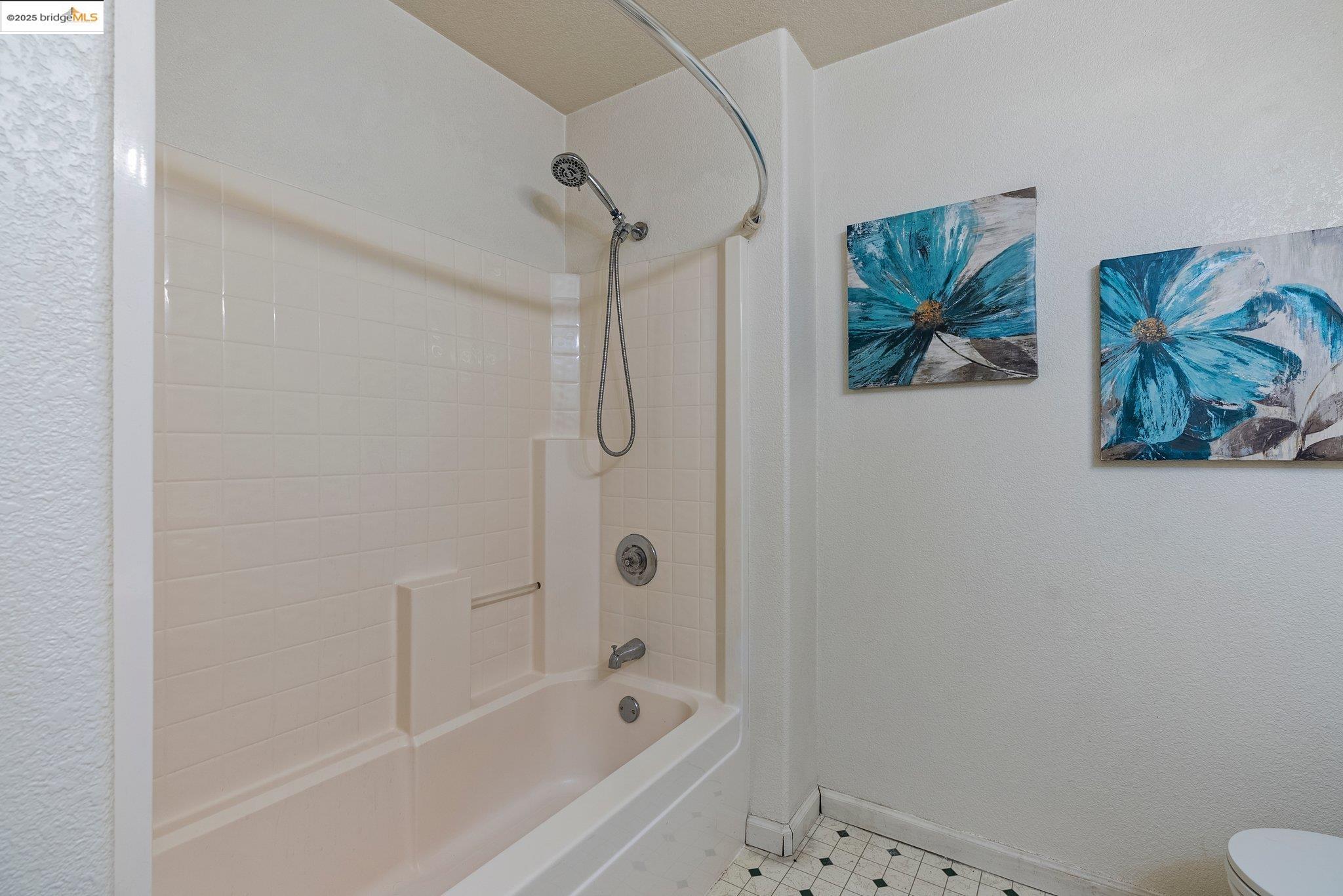 5200 Mohican Way Antioch, CA 94531 - Photo 34 of 50 a bathroom with a bathtub and a shower