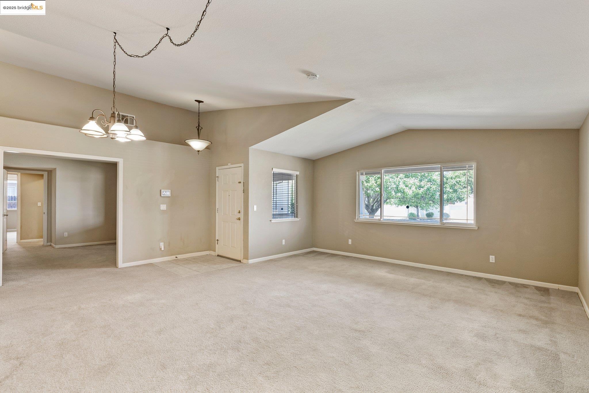 5200 Mohican Way Antioch, CA 94531 - Photo 6 of 50 an empty room with chandelier fan and windows