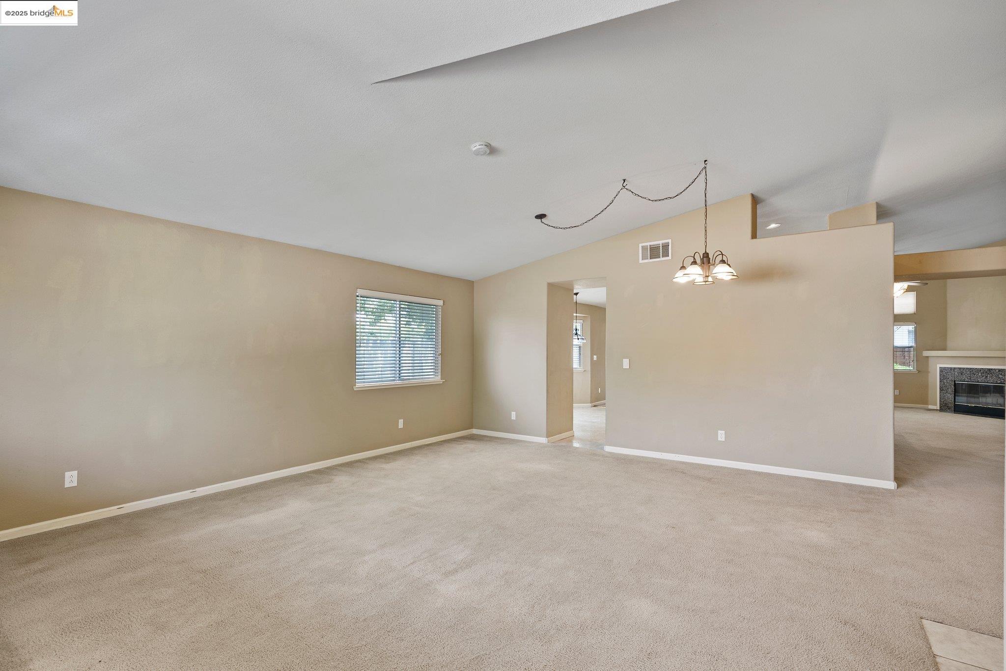 5200 Mohican Way Antioch, CA 94531 - Photo 7 of 50 an empty room with chandelier fan and windows