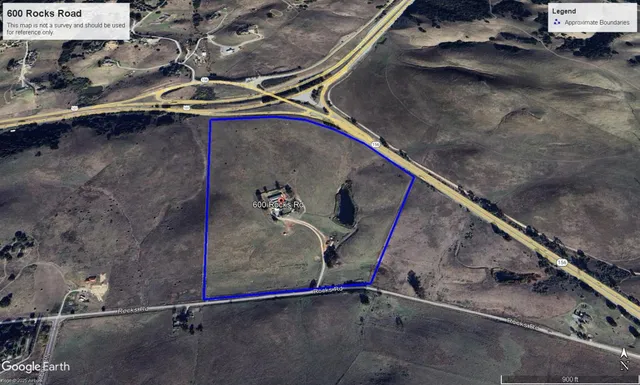 an aerial view of a house with a lake view