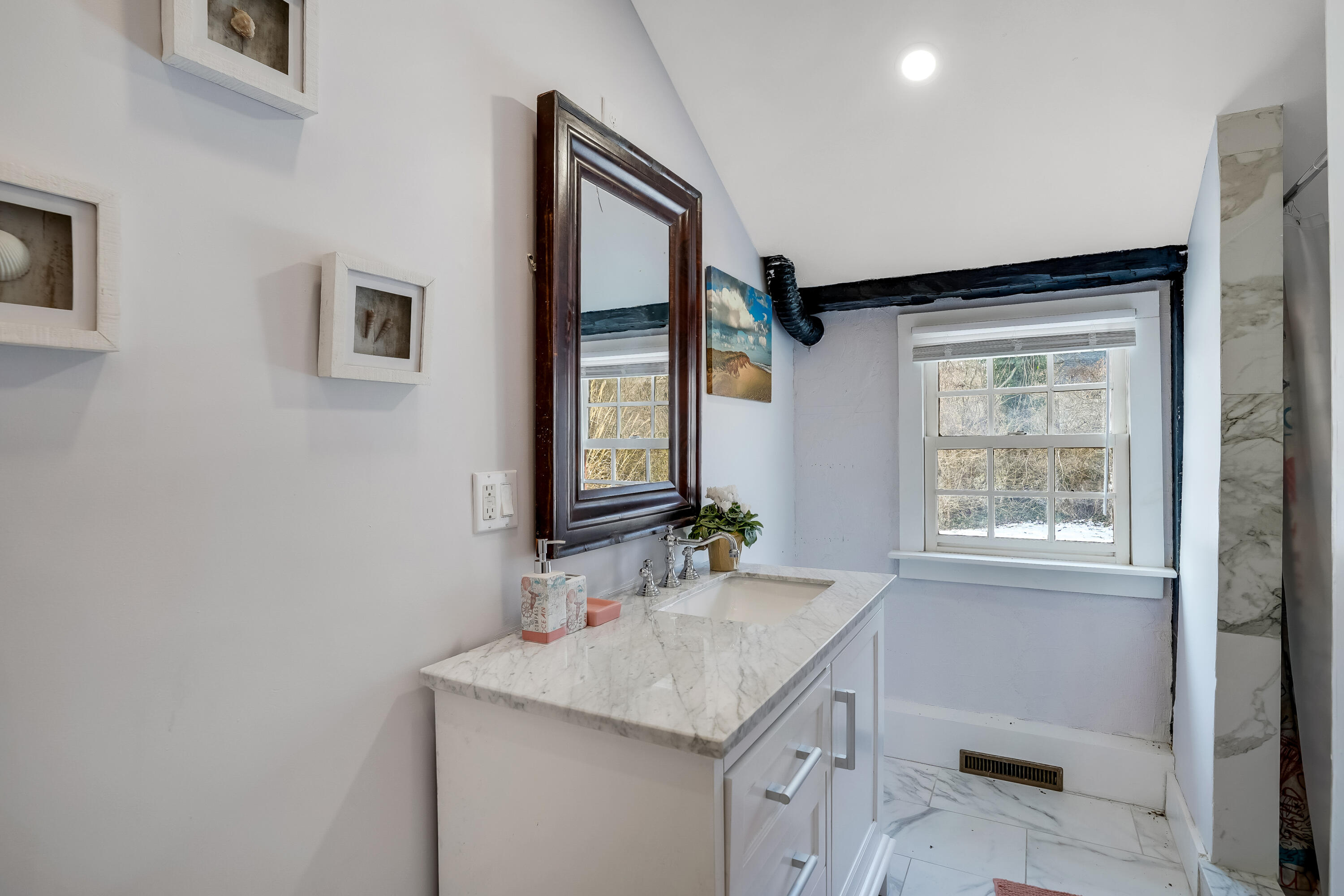 32 Norton Orchard Road Edgartown, MA 02539 - Photo 16 of 26 a bathroom with a granite countertop sink a toilet and a mirror