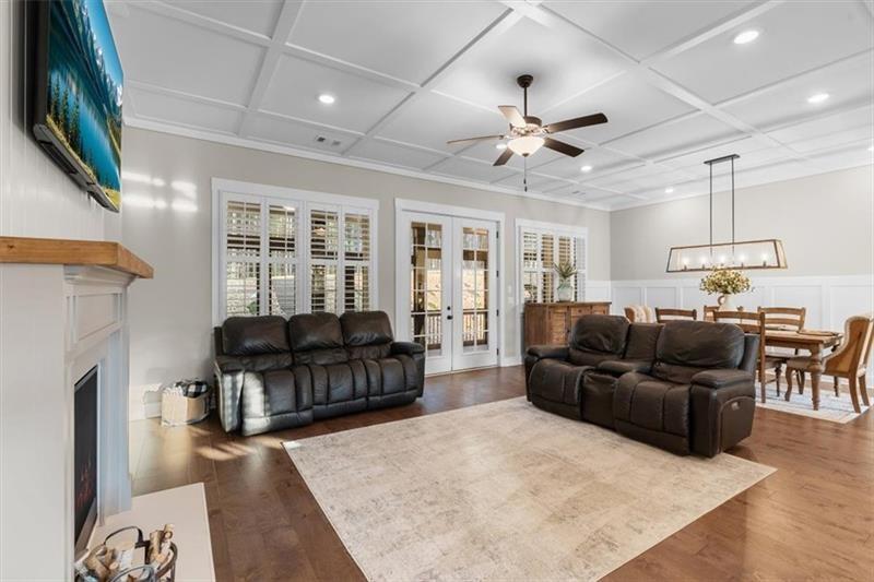 283 London Road Ball Ground, GA 30107 - Photo 19 of 73 a living room with furniture and a flat screen tv
