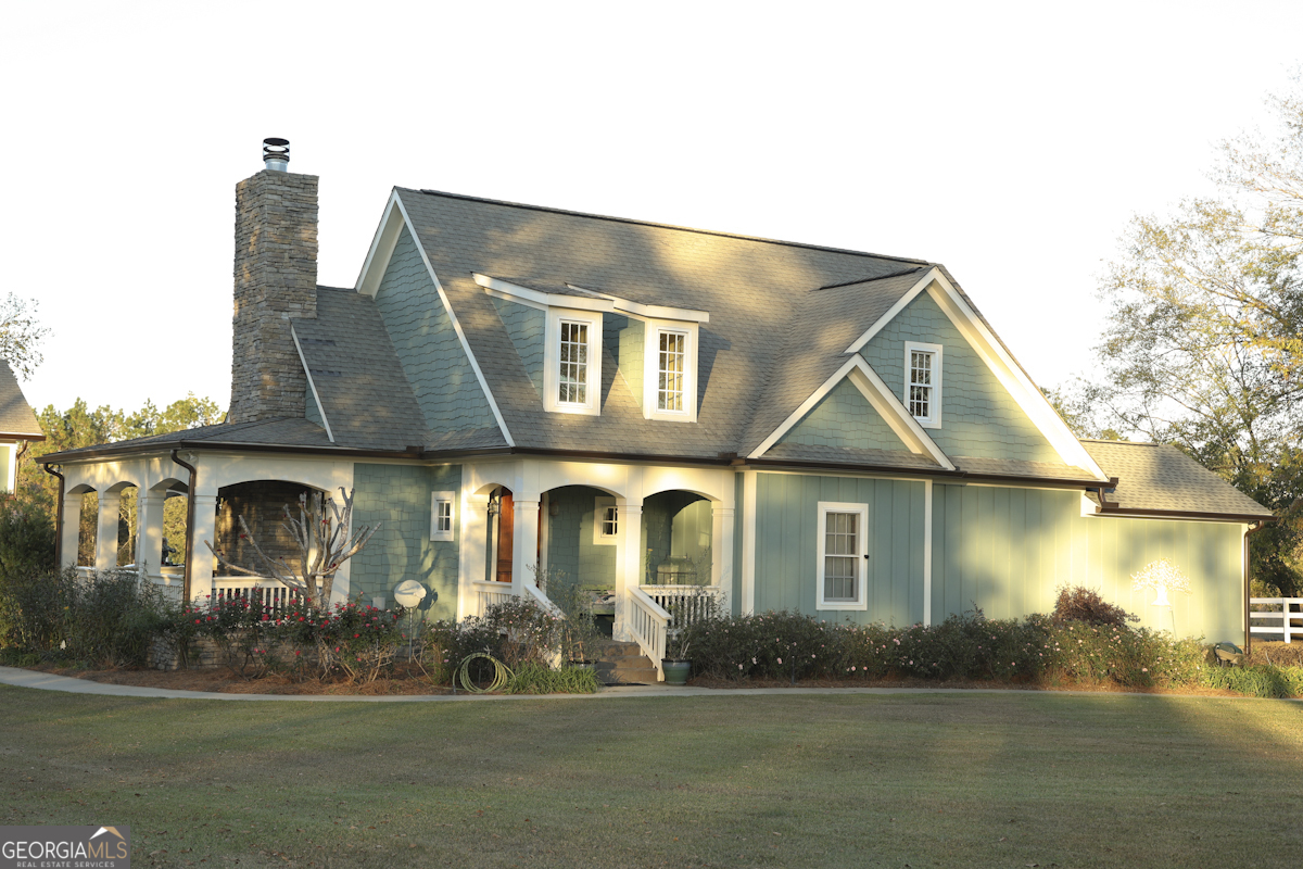 585 Old Savannah Road Ailey, GA 30410 - Photo 1 of 2 a front view of a house with a yard