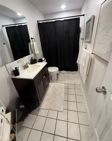 a kitchen with sink and refrigerator