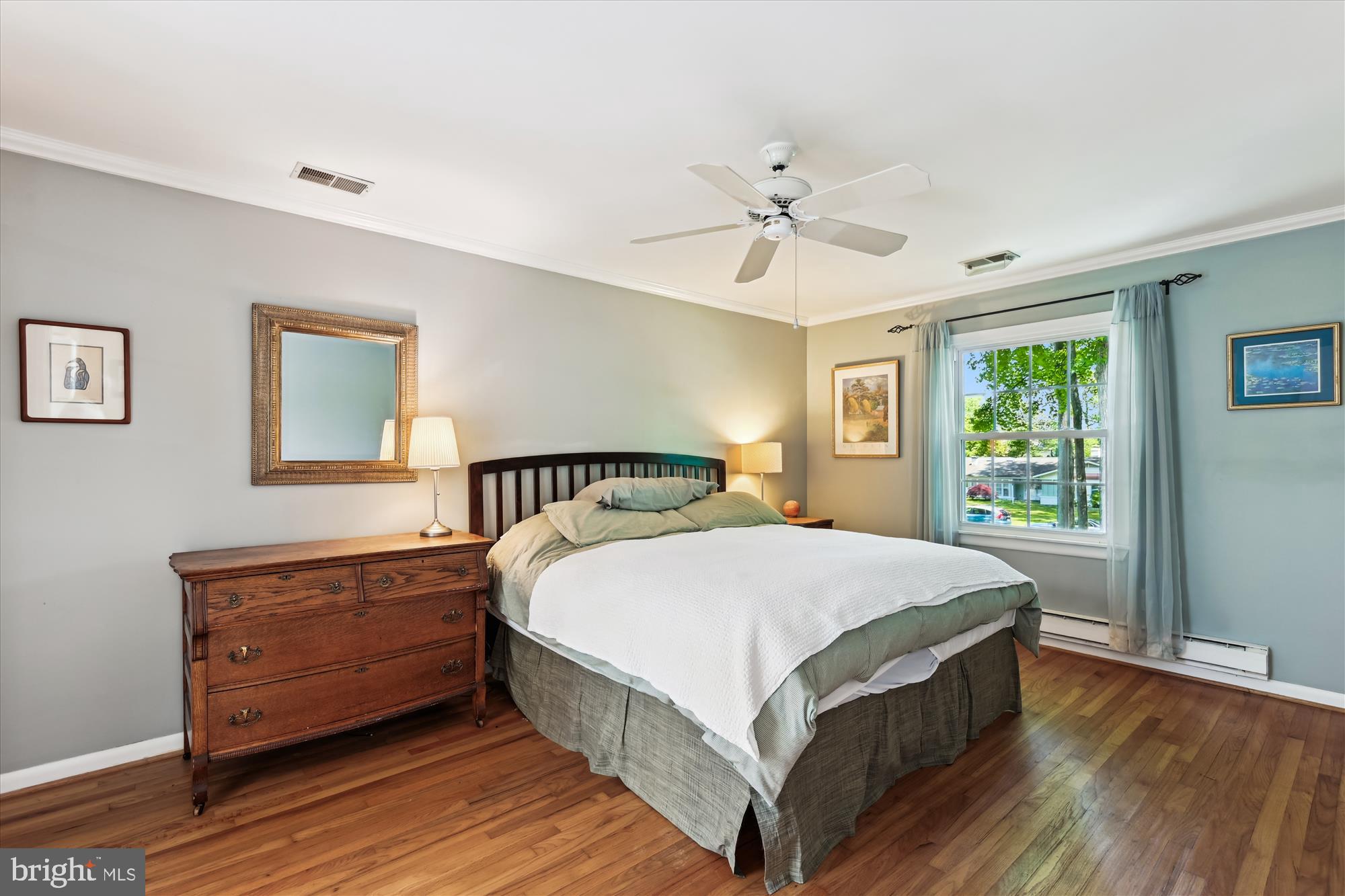 2104 Harbor Drive Annapolis, MD 21409 - Photo 18 of 86 a bedroom with a large bed a chandelier and a window