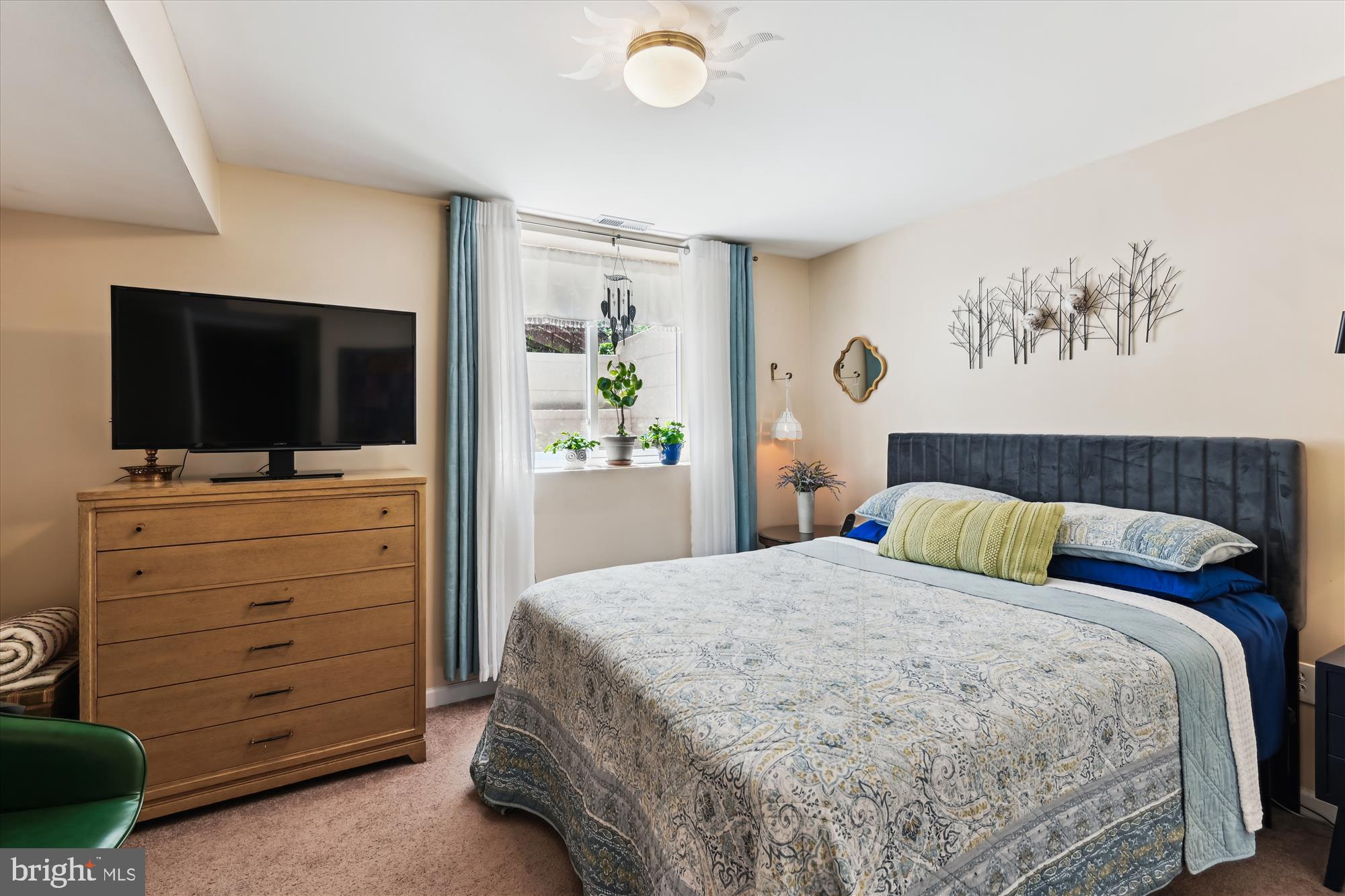 2104 Harbor Drive Annapolis, MD 21409 - Photo 31 of 86 a bedroom with a bed and a flat screen tv