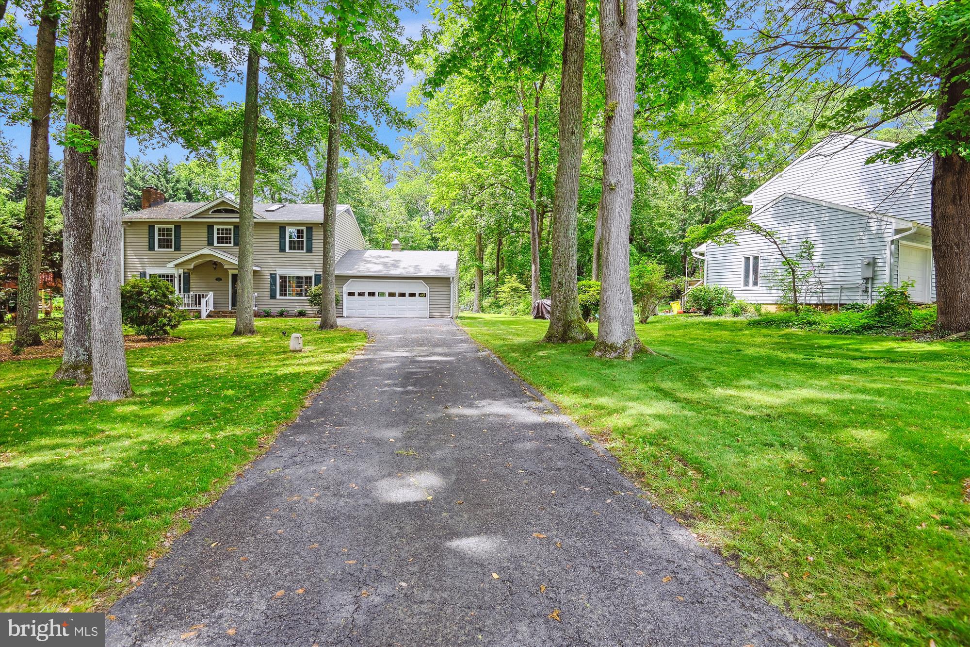 2104 Harbor Drive Annapolis, MD 21409 - Photo 33 of 86 a front view of a house with a yard and trees