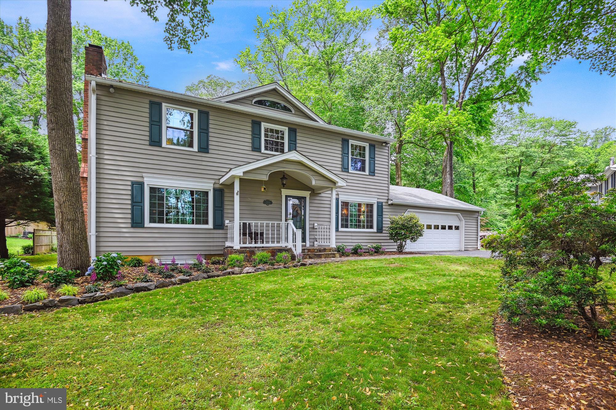 2104 Harbor Drive Annapolis, MD 21409 - Photo 35 of 86 a front view of a house with a yard and green space