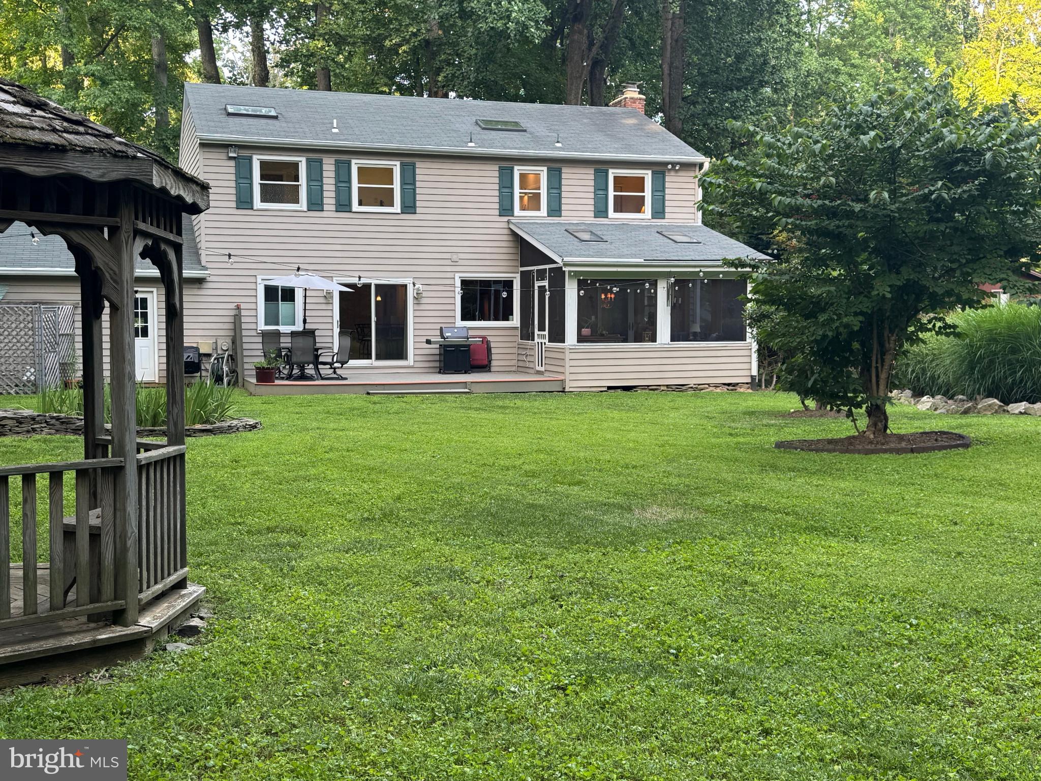 2104 Harbor Drive Annapolis, MD 21409 - Photo 4 of 86 a front view of a house with a garden and trees