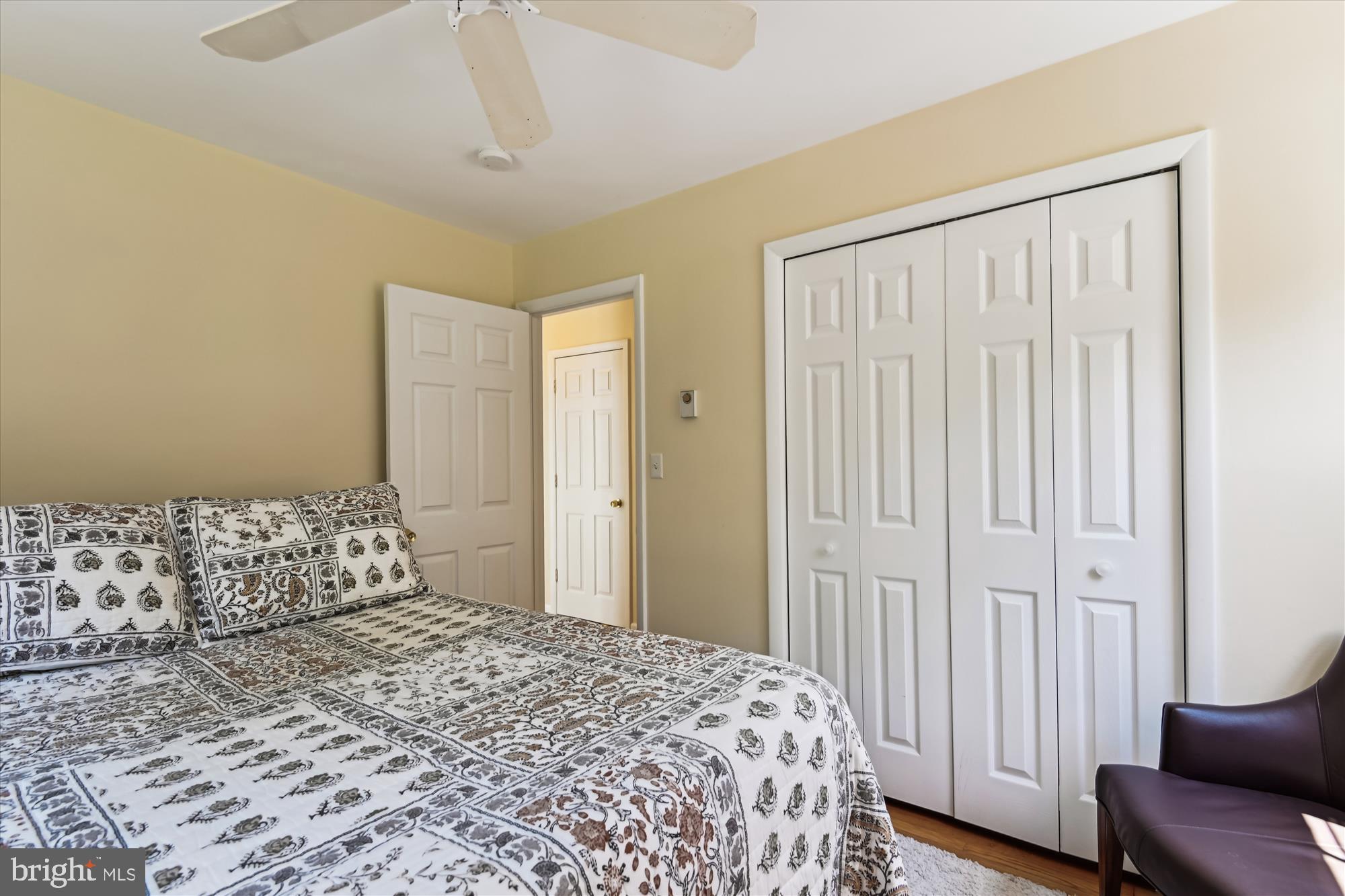 2104 Harbor Drive Annapolis, MD 21409 - Photo 57 of 86 a bedroom with a bed and a chair