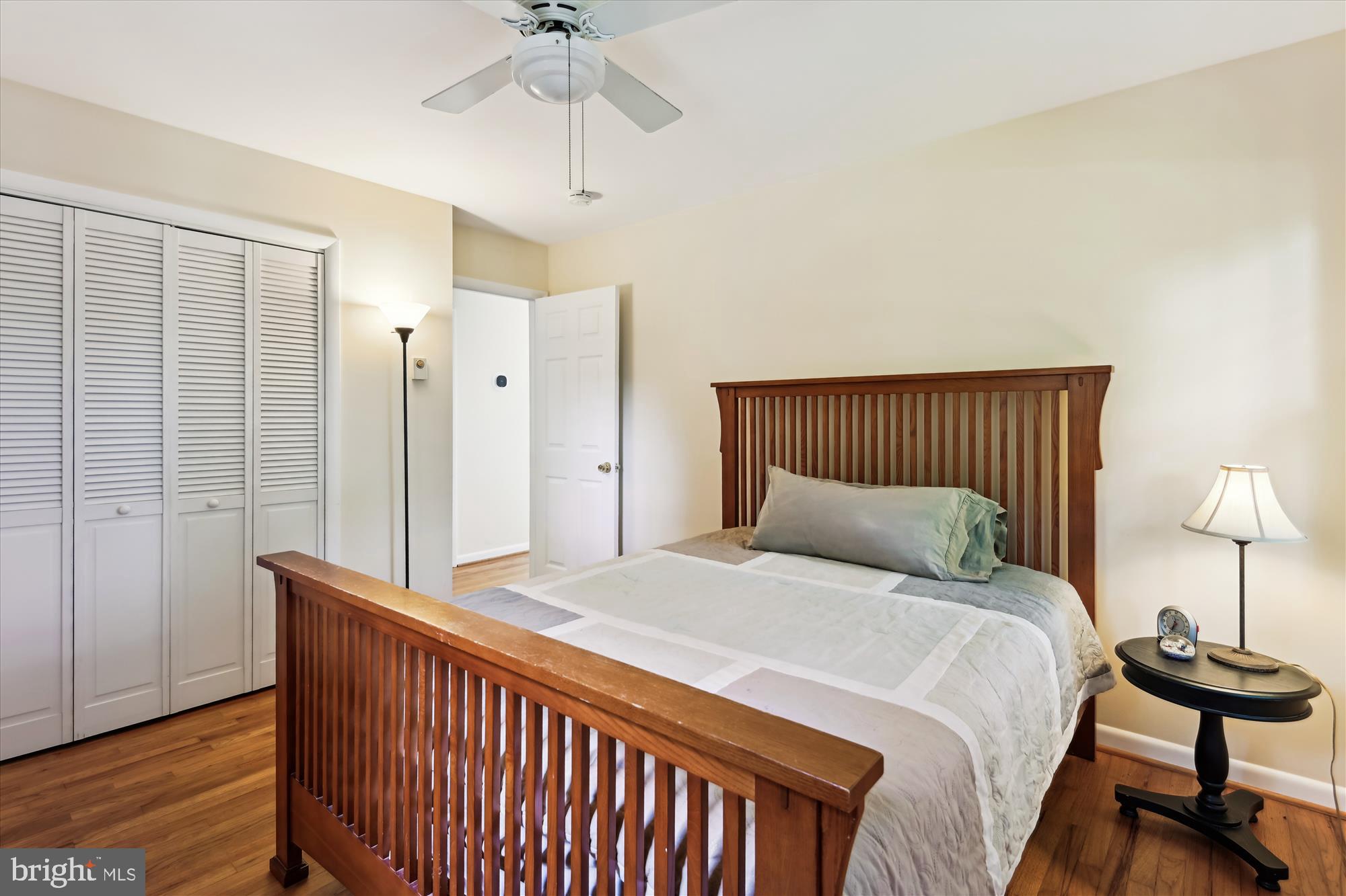 2104 Harbor Drive Annapolis, MD 21409 - Photo 59 of 86 a bedroom with a bed and a lamp