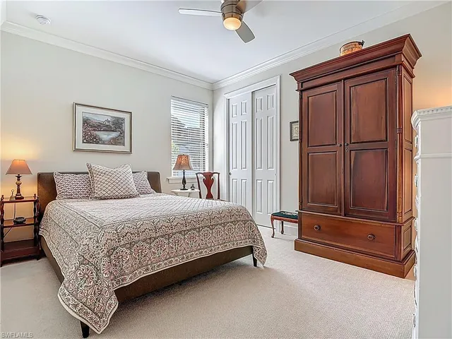 a bedroom with a bed and a cabinets