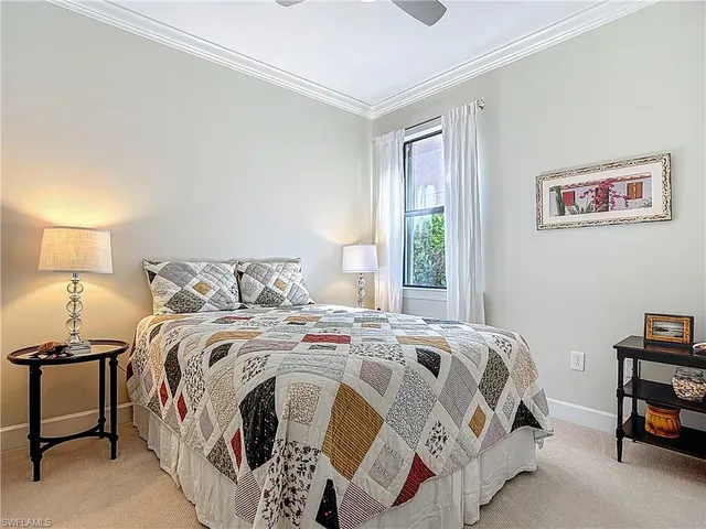 a bedroom with bed and a window