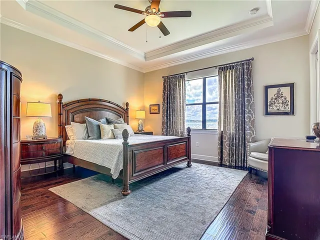 a spacious bedroom with a bed and window