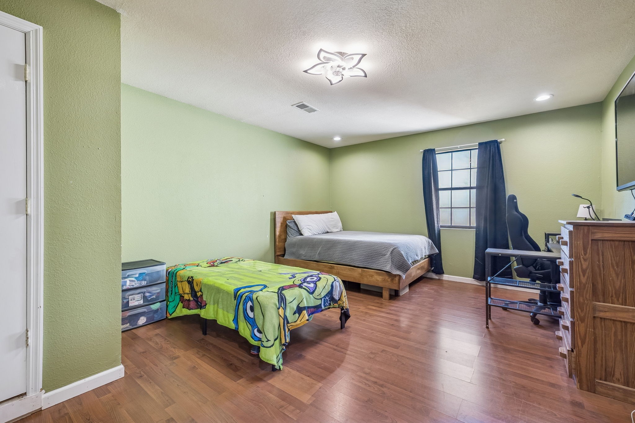 485 Lower Roans Creek Road Linden, TN 37096 - Photo 30 of 43 a bedroom with a bed and a chandelier