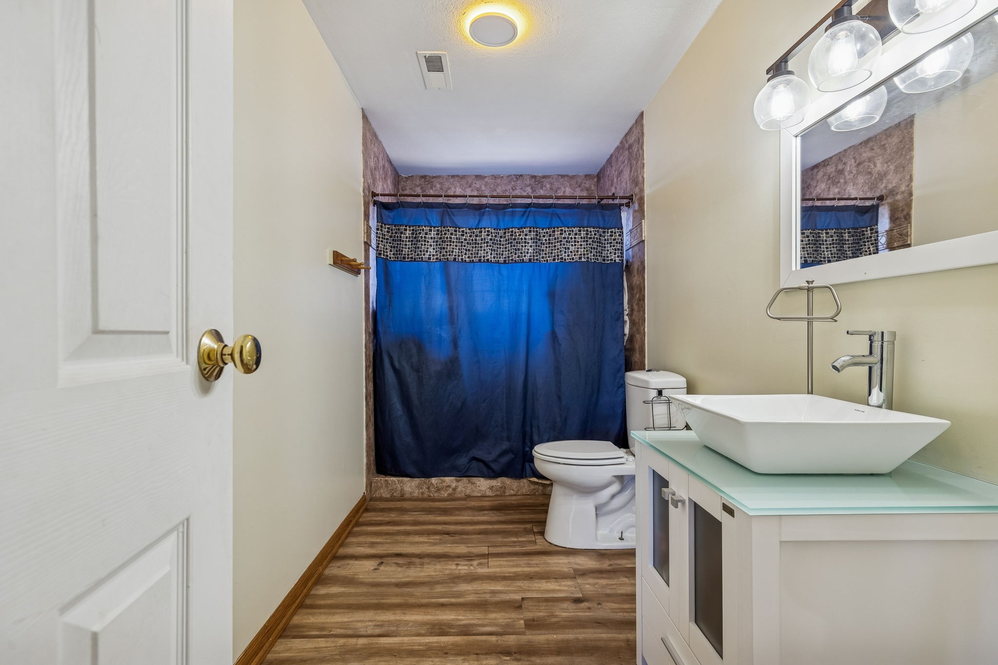 485 Lower Roans Creek Road Linden, TN 37096 - Photo 34 of 43 a bathroom with a sink a toilet and shower