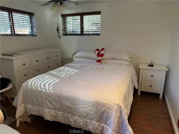 a bedroom with a bed and a dresser