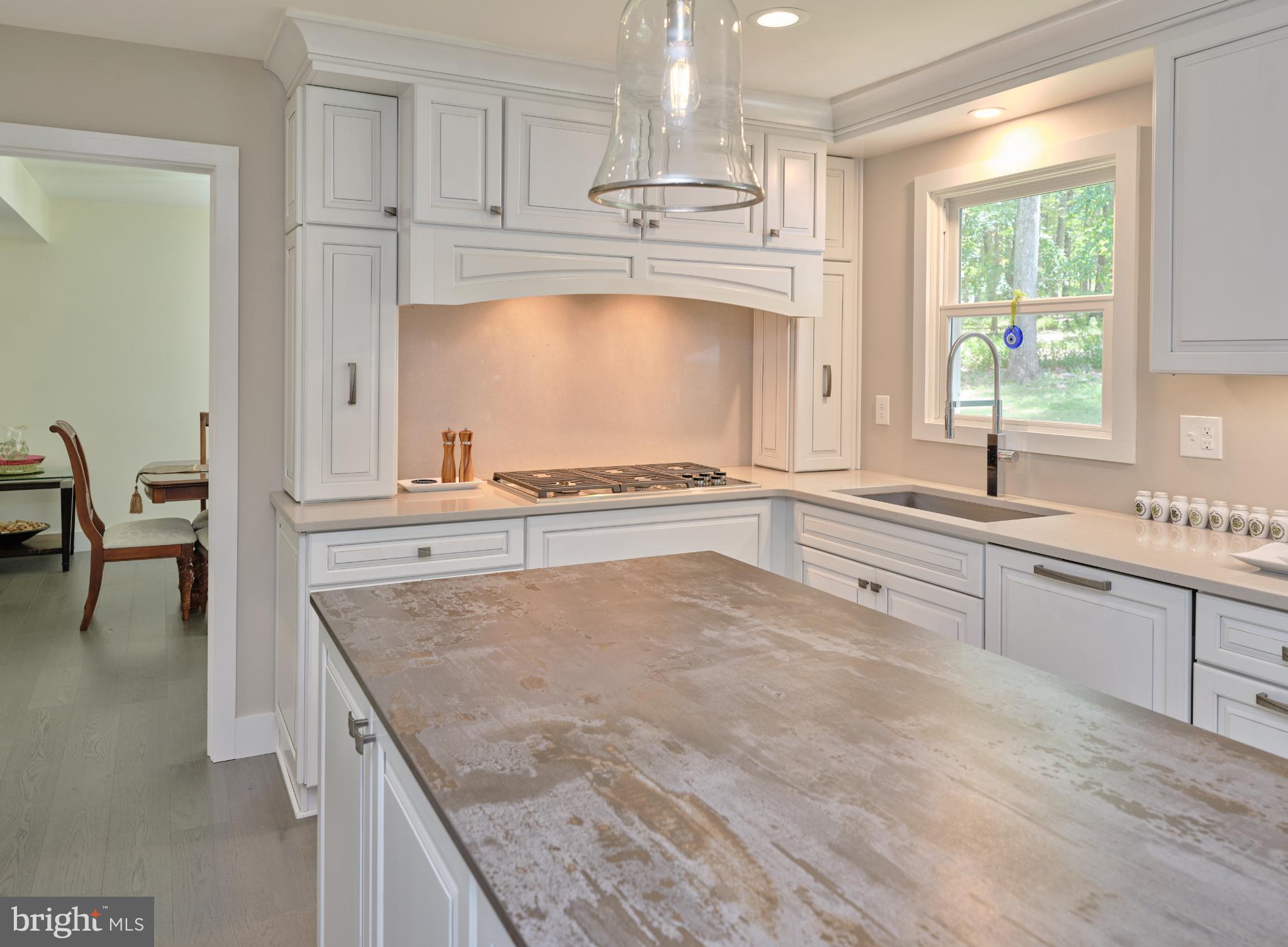 7000 Ely Road New Hope, PA 18938 - Photo 11 of 44 a kitchen with granite countertop a stove a sink and a counter space