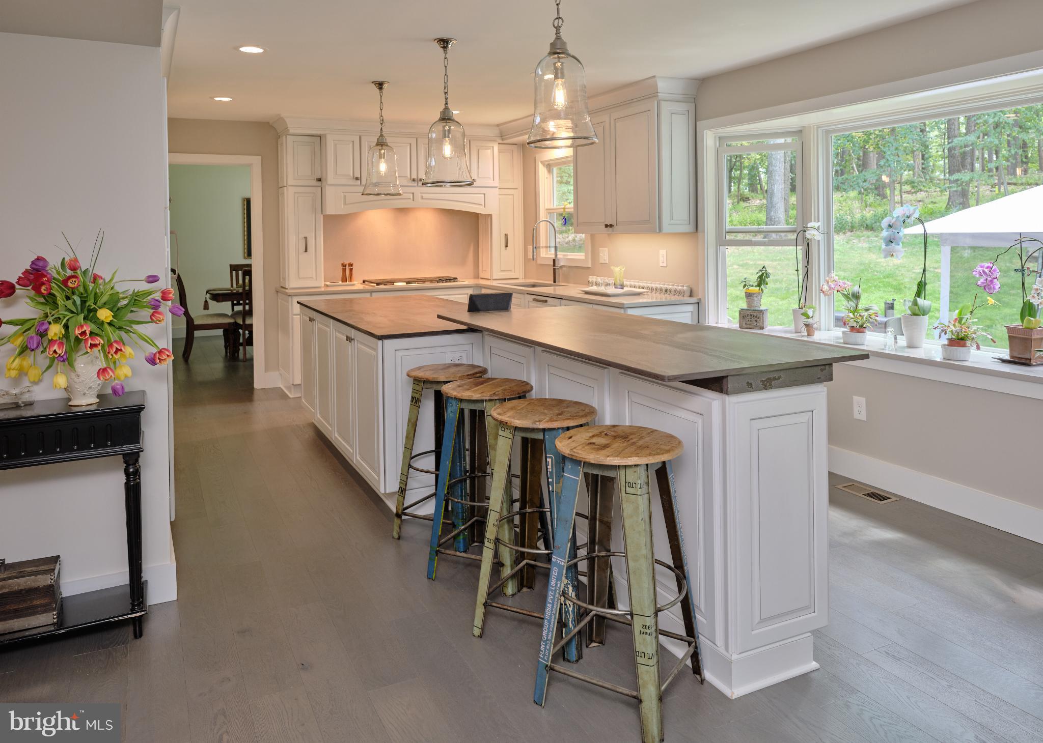 7000 Ely Road New Hope, PA 18938 - Photo 13 of 44 a kitchen with kitchen island granite countertop lots of counter top space and refrigerator