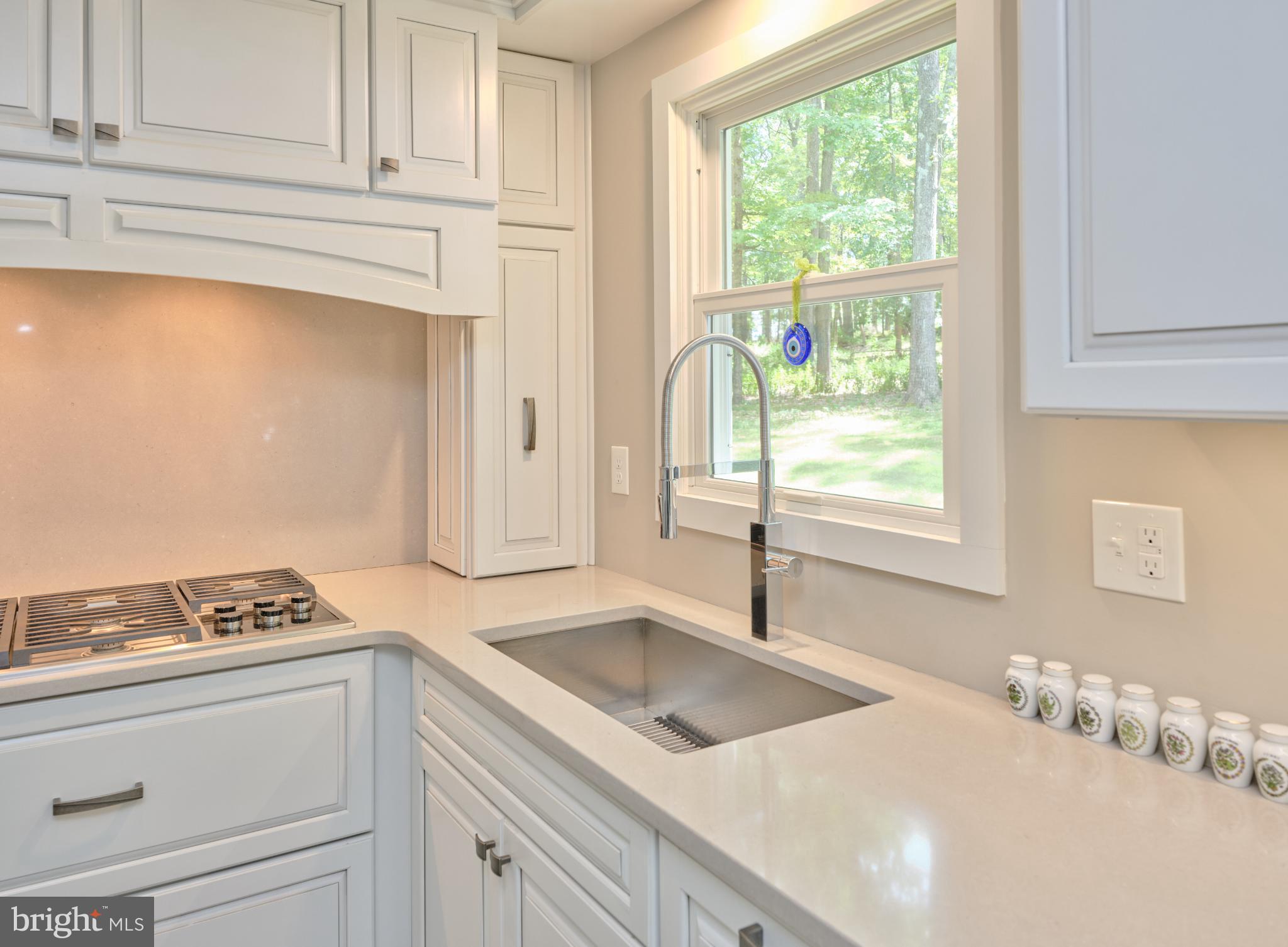 7000 Ely Road New Hope, PA 18938 - Photo 15 of 44 a kitchen with granite countertop a sink and a window
