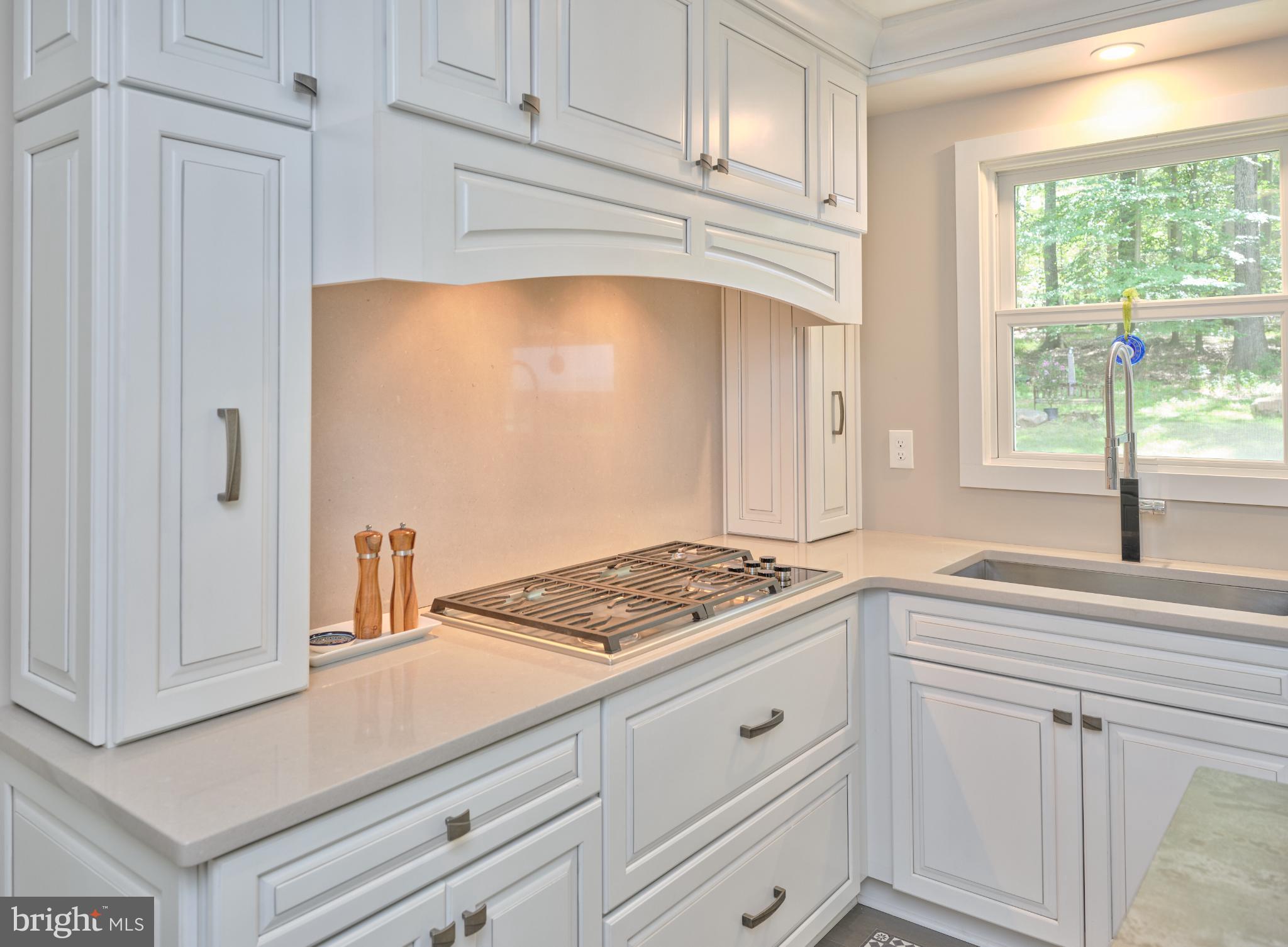7000 Ely Road New Hope, PA 18938 - Photo 17 of 44 a kitchen with white cabinets and window