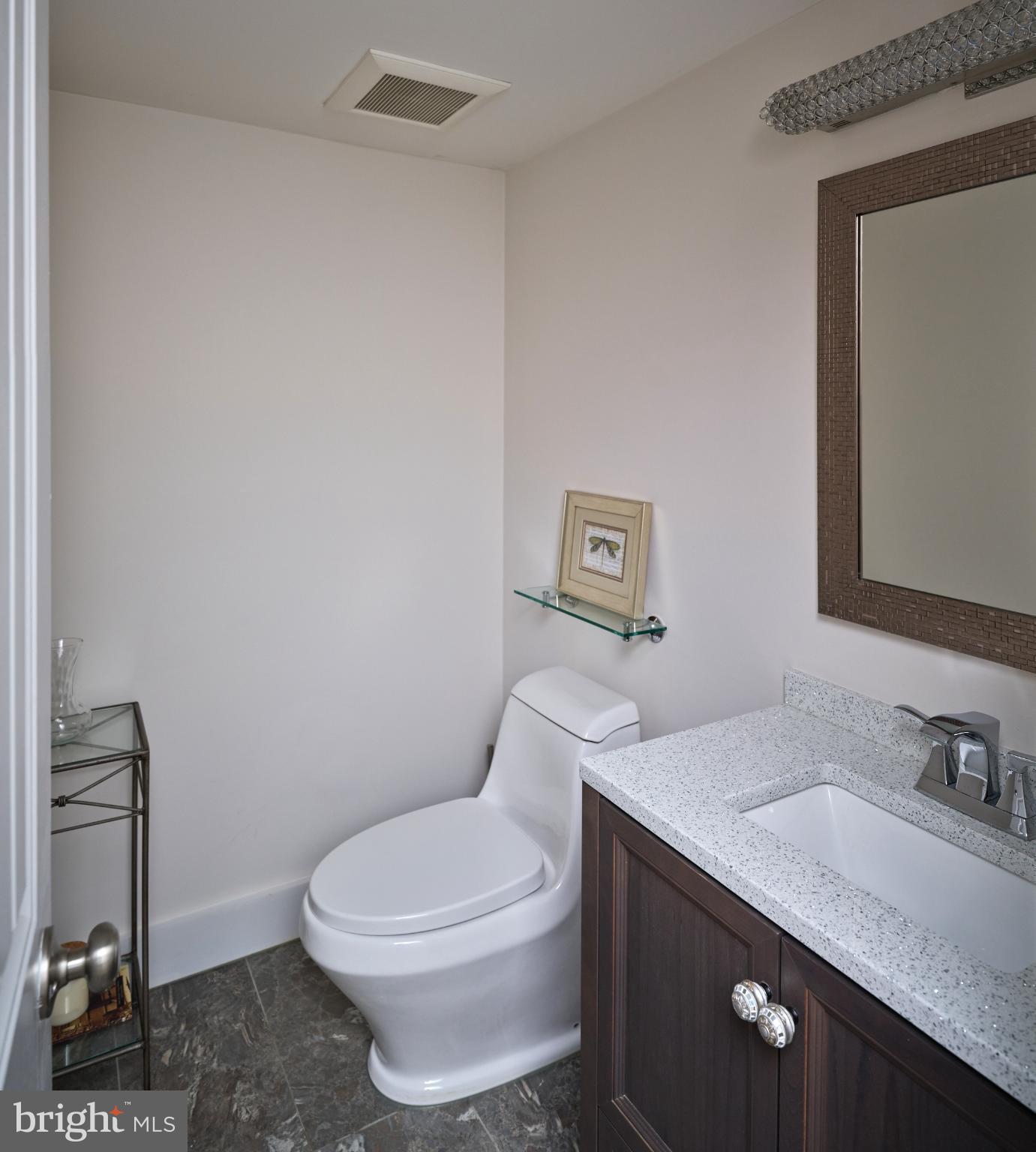 7000 Ely Road New Hope, PA 18938 - Photo 19 of 44 a bathroom with a granite countertop toilet sink and mirror