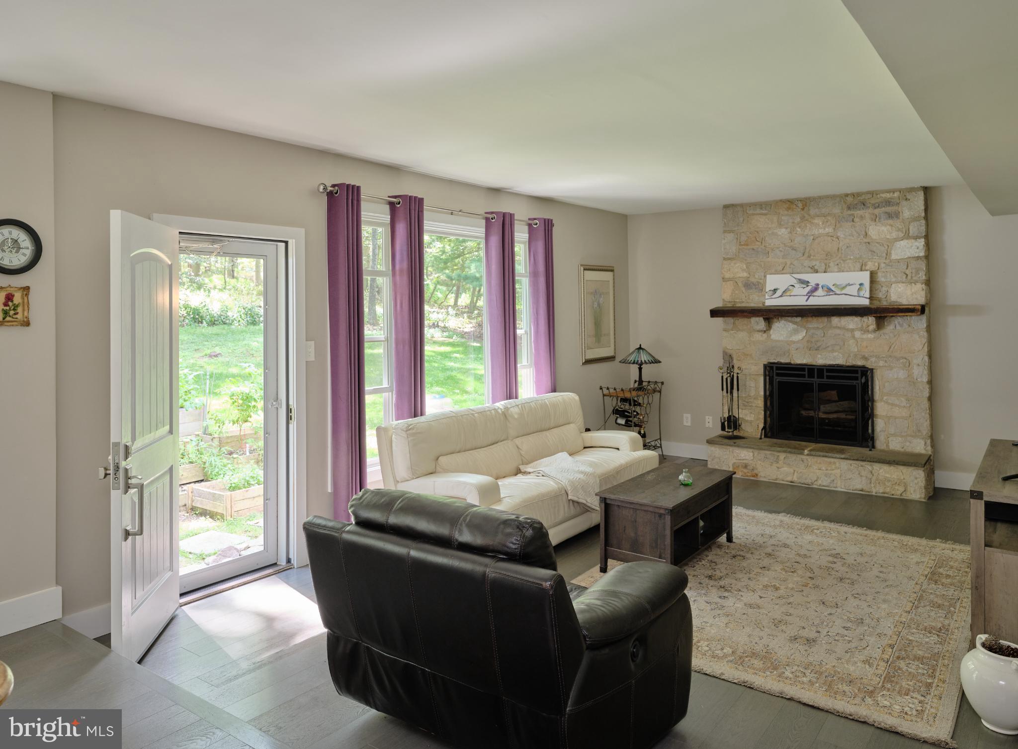 7000 Ely Road New Hope, PA 18938 - Photo 20 of 44 a living room with furniture and a fireplace