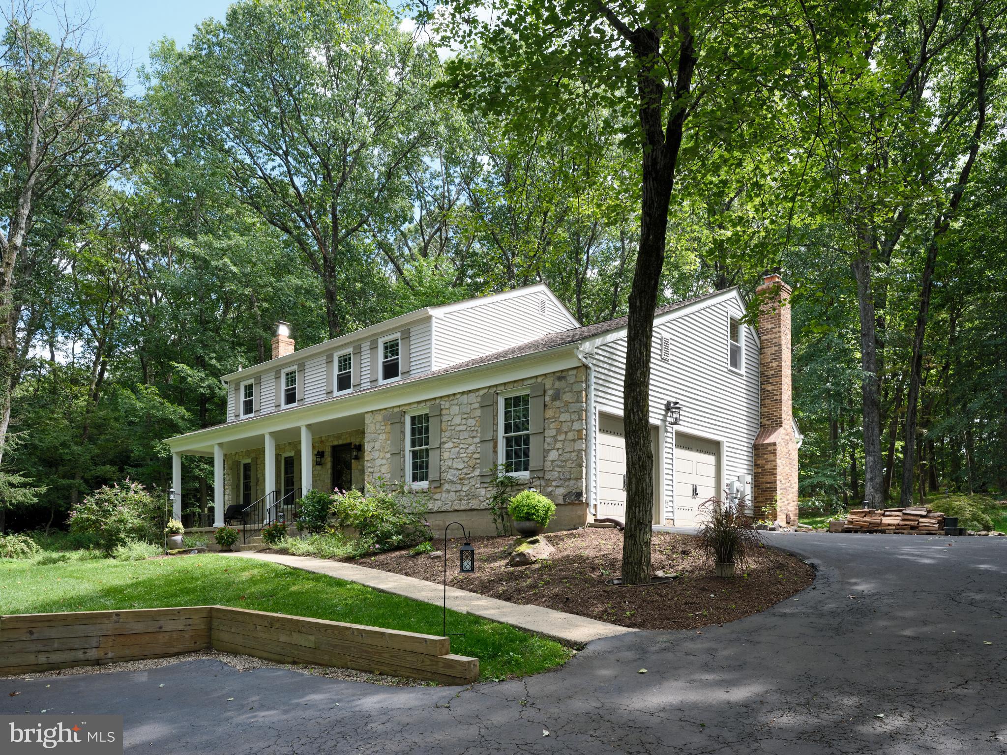 7000 Ely Road New Hope, PA 18938 - Photo 2 of 44 a front view of a house with a yard and porch