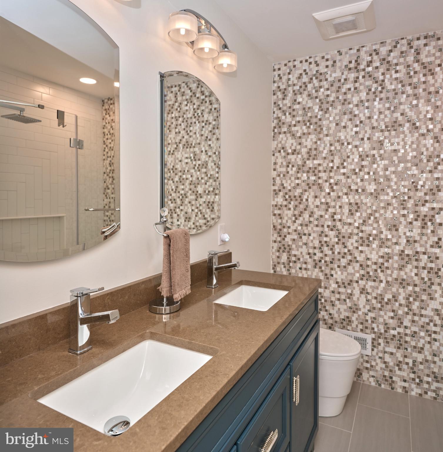7000 Ely Road New Hope, PA 18938 - Photo 28 of 44 a bathroom with a sink a toilet and a mirror