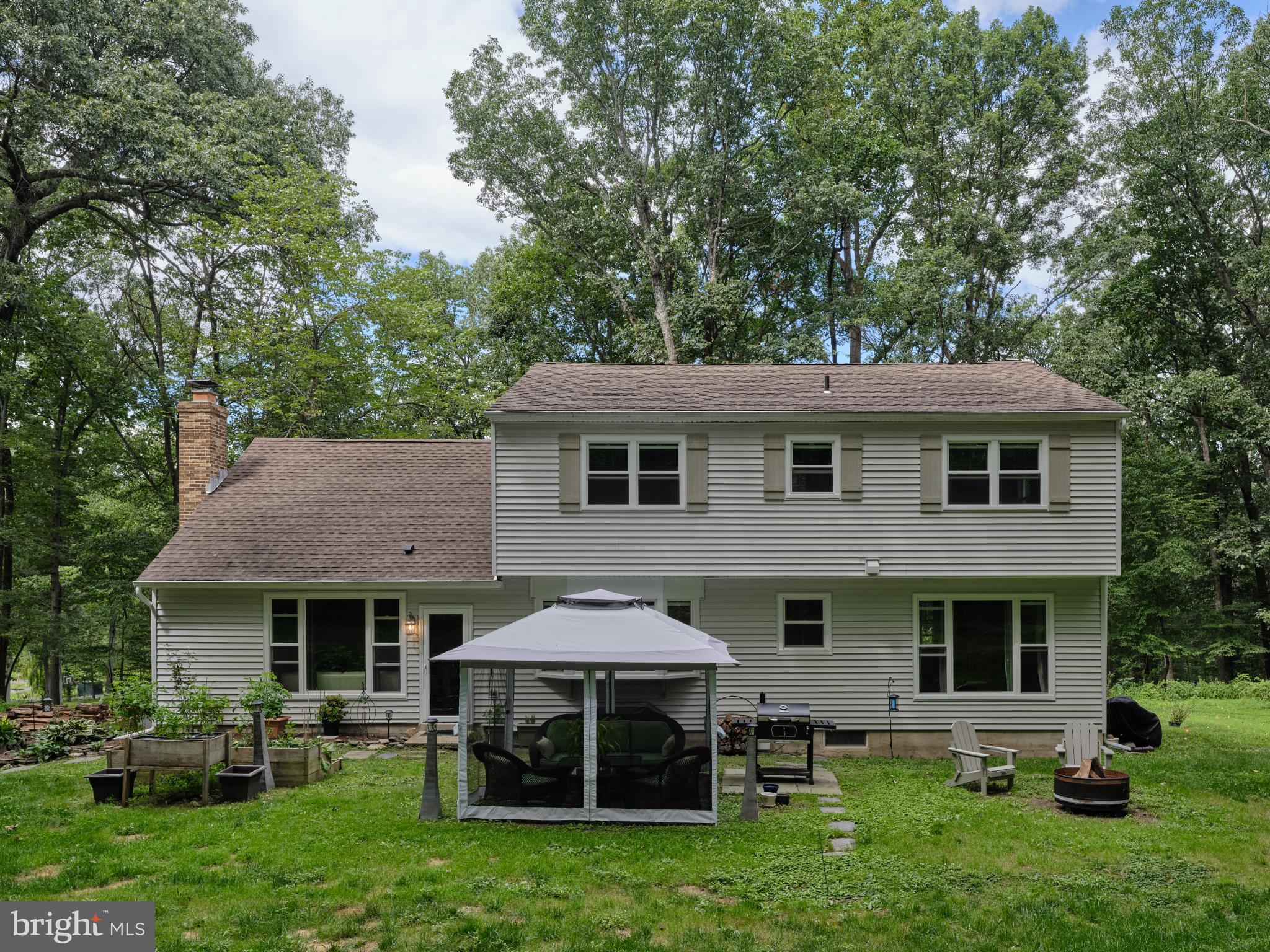 7000 Ely Road New Hope, PA 18938 - Photo 38 of 44 a view of a house with a backyard and a patio