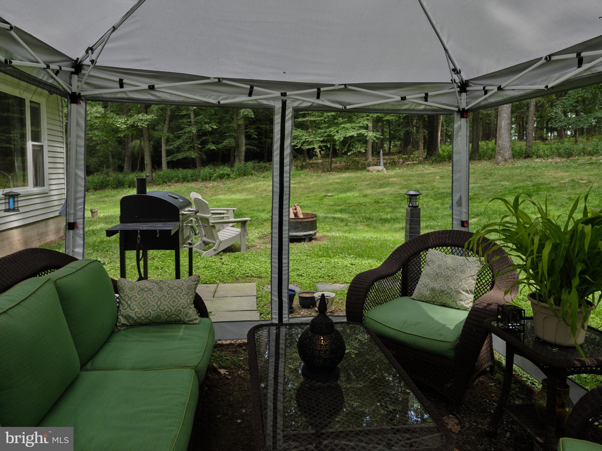 7000 Ely Road New Hope, PA 18938 - Photo 39 of 44 a view of a chair and tables in the patio next to a yard