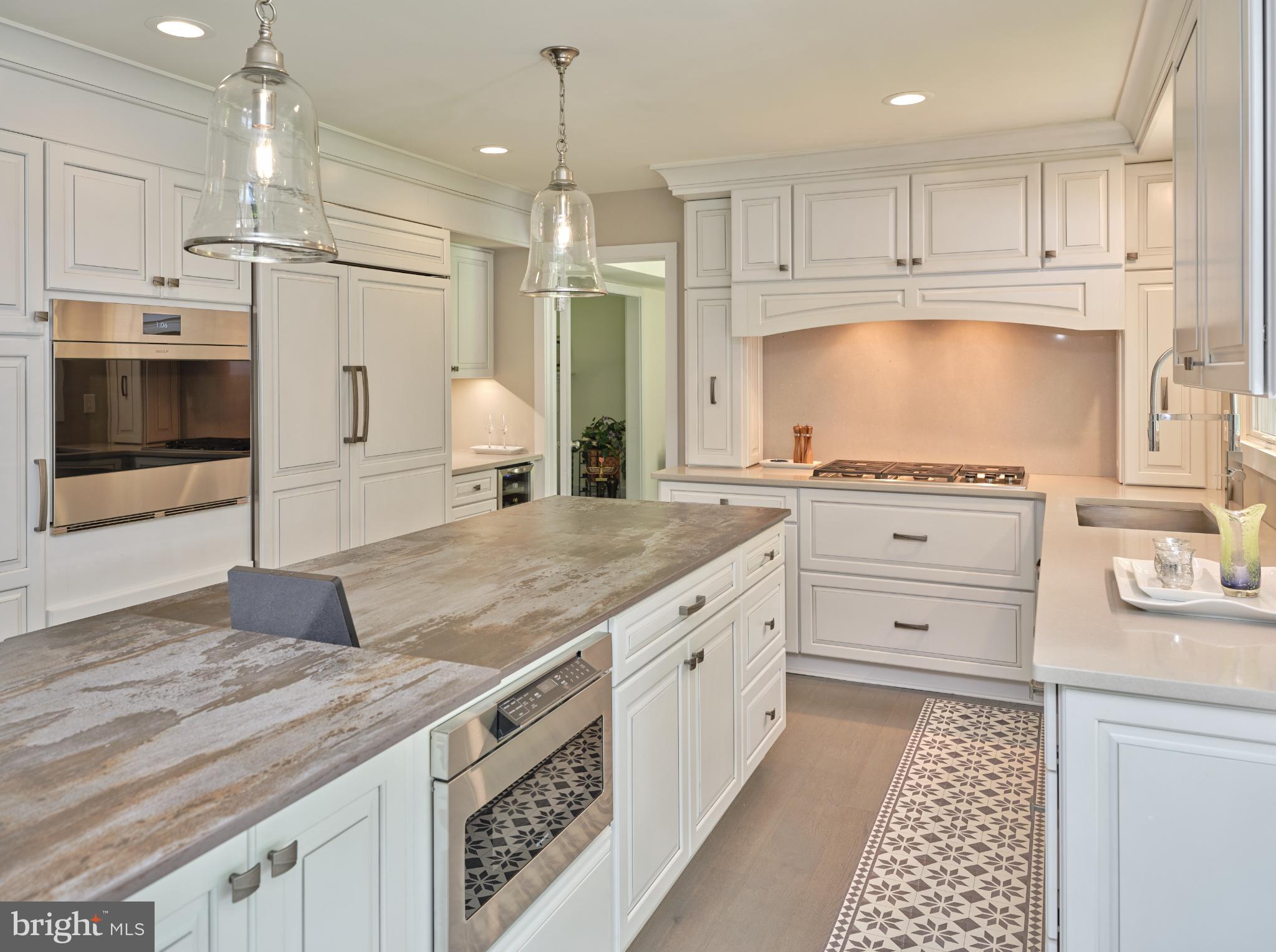 7000 Ely Road New Hope, PA 18938 - Photo 10 of 44 a kitchen with granite countertop a white stove top oven and cabinets