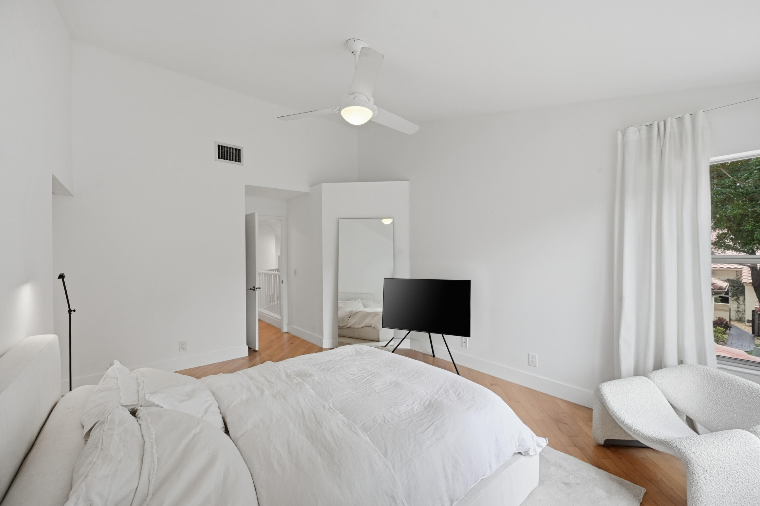 5205 Majorca Club Drive Boca Raton, FL 33486 - Photo 14 of 29 a bedroom with a bed and a flat screen tv