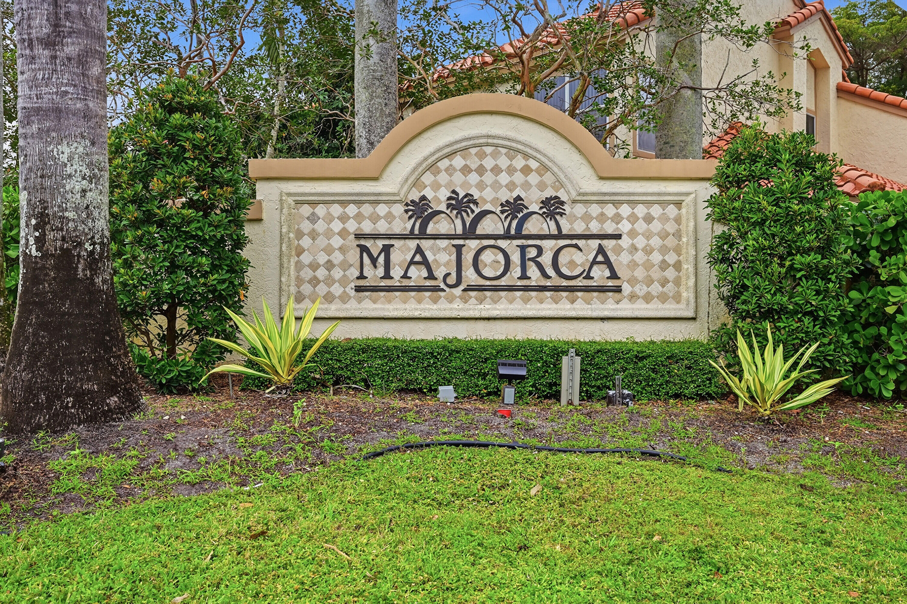5205 Majorca Club Drive Boca Raton, FL 33486 - Photo 29 of 29 a view of sign broad in front of red brick house