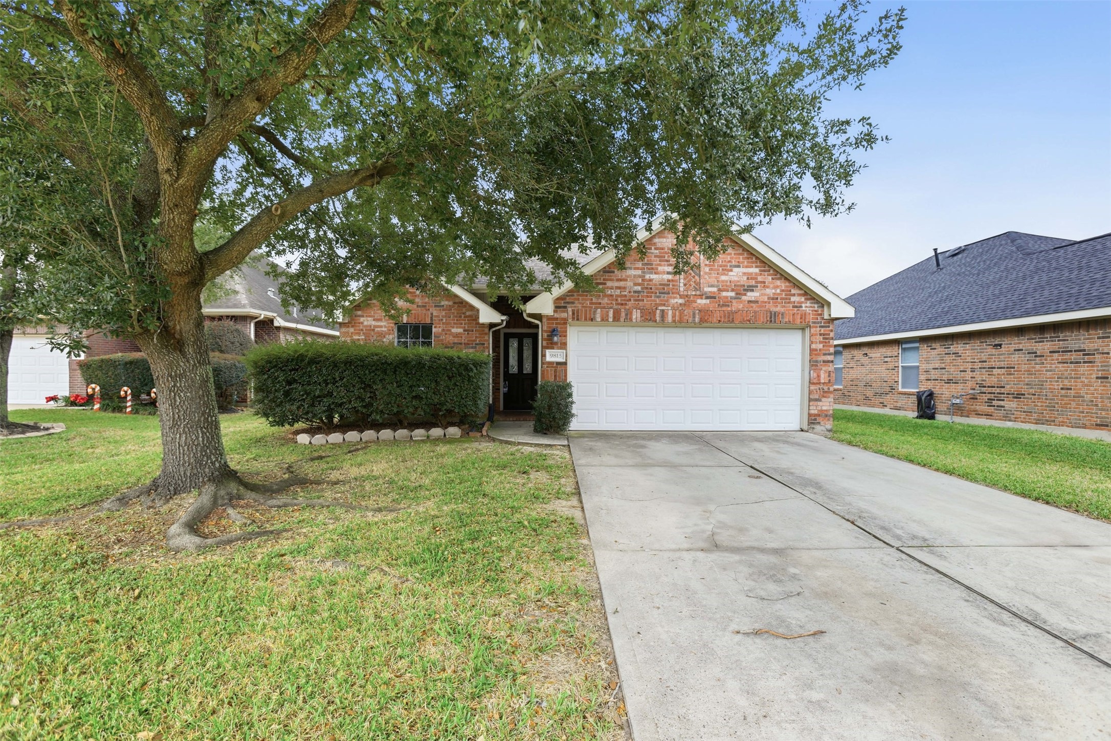 9815 Wedgeford Court Houston, TX 77044 - Photo 1 of 24 a front view of a house with a yard and a garage