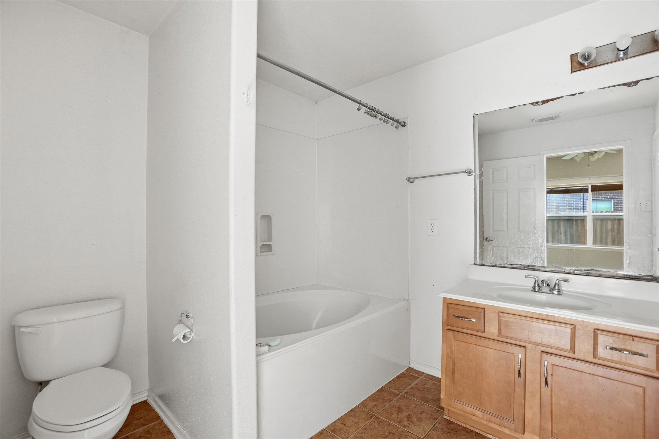 9815 Wedgeford Court Houston, TX 77044 - Photo 11 of 24 a bathroom with a sink a toilet and shower