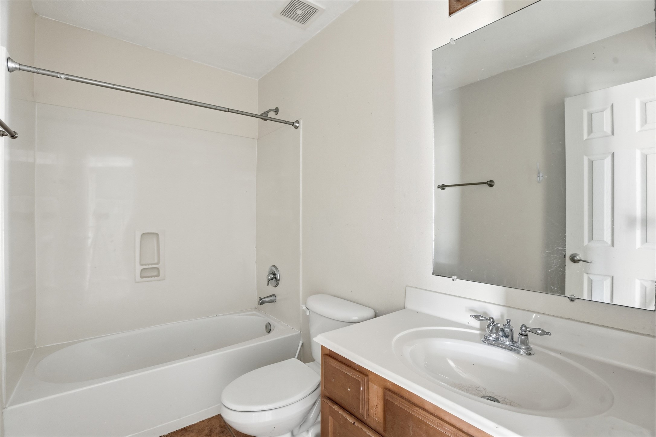 9815 Wedgeford Court Houston, TX 77044 - Photo 13 of 24 a bathroom with a bathtub shower sink vanity and toilet