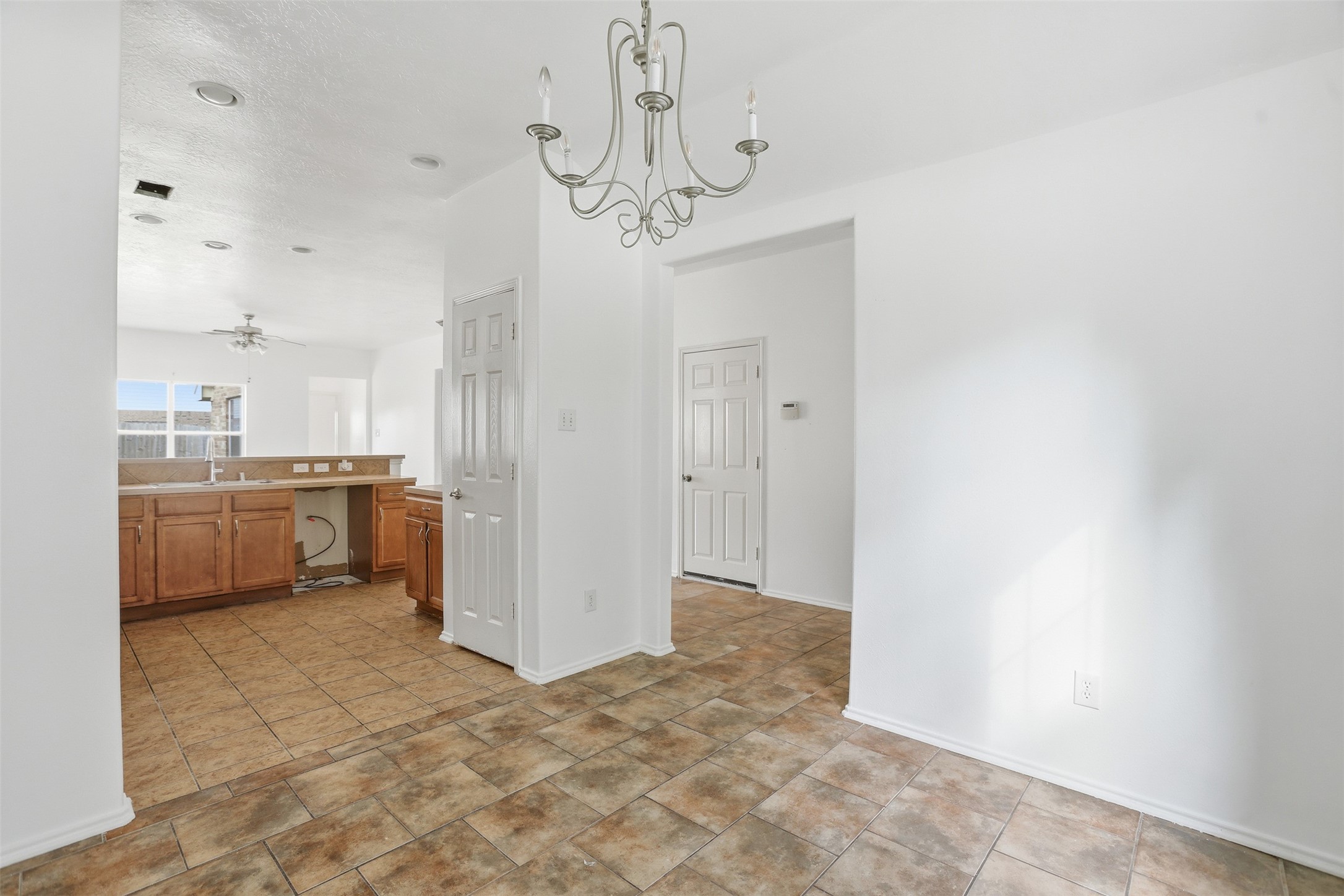 9815 Wedgeford Court Houston, TX 77044 - Photo 24 of 24 a view of a kitchen with a sink and a refrigerator