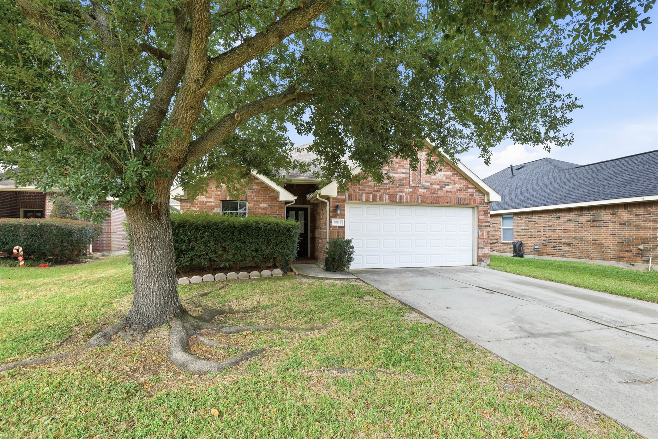 9815 Wedgeford Court Houston, TX 77044 - Photo 4 of 24 a front view of a house with a yard and garage