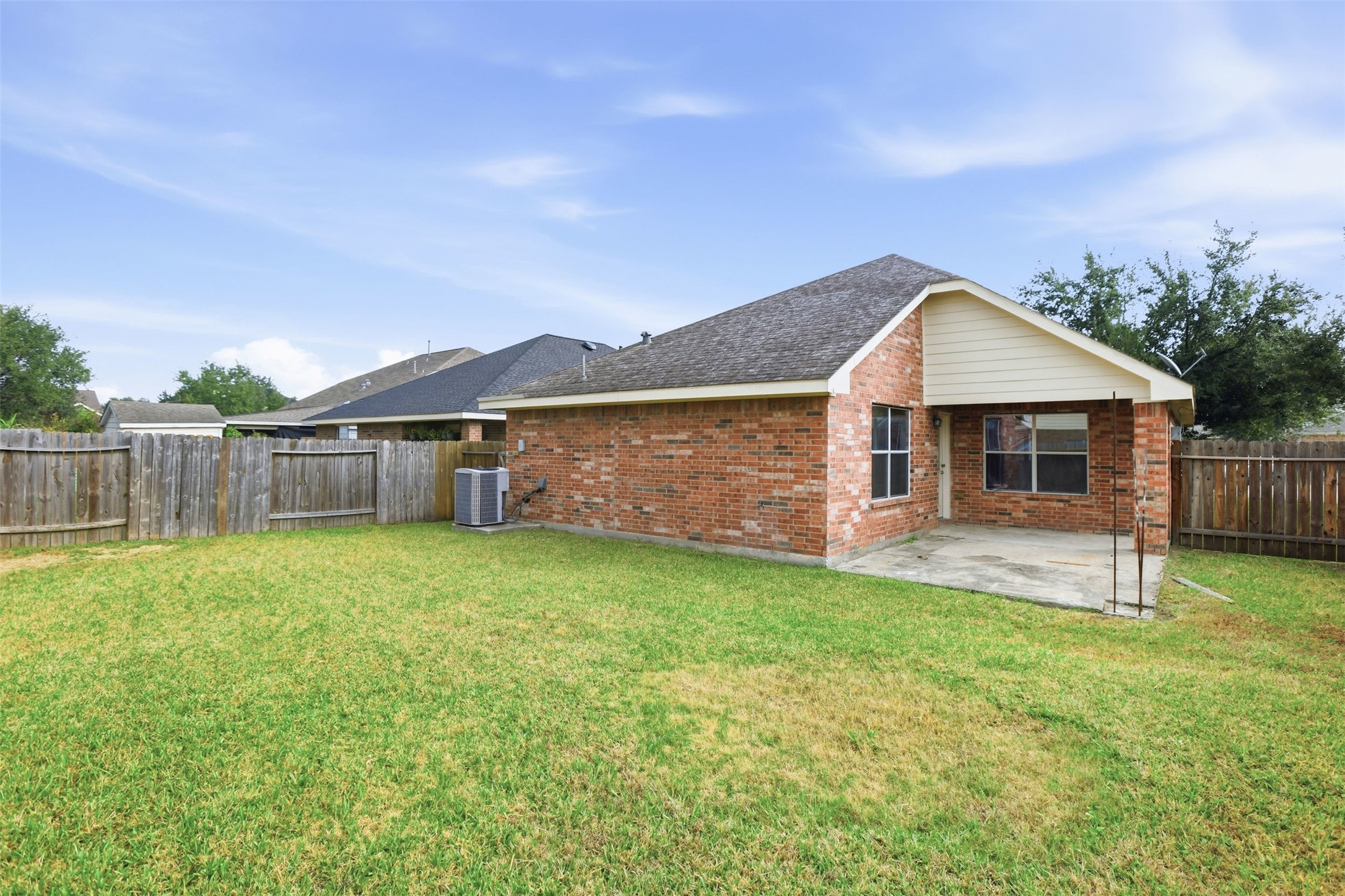 9815 Wedgeford Court Houston, TX 77044 - Photo 6 of 24 a front view of a house with a garden and yard