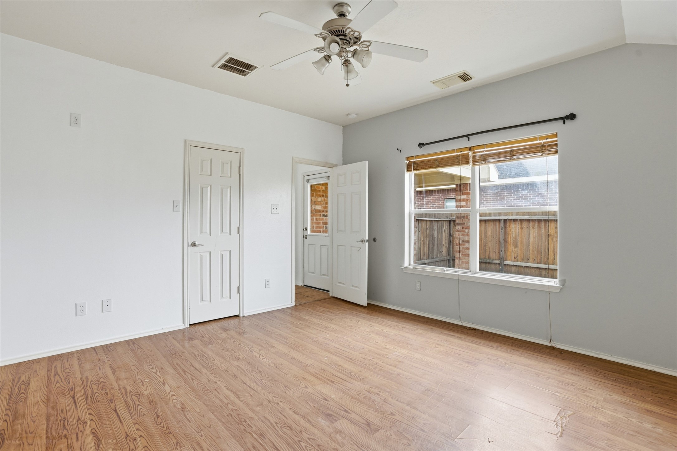 9815 Wedgeford Court Houston, TX 77044 - Photo 9 of 24 a view of an empty room with a window