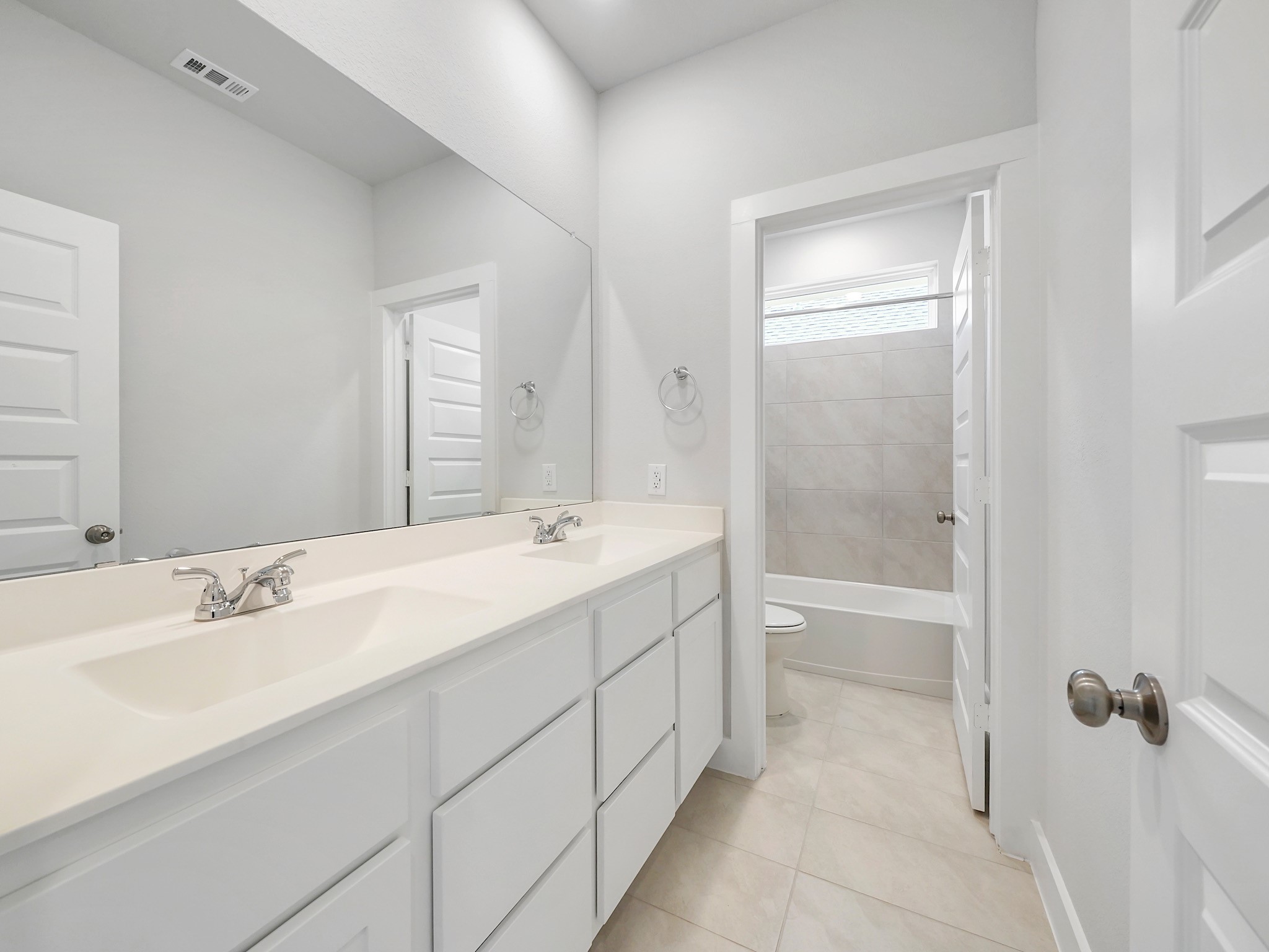 6010 Rolling Strm Court Fulshear, TX 77441 - Photo 21 of 23 Spacious secondary bathroom upstairs offers a separate vanity area with dual sinks!